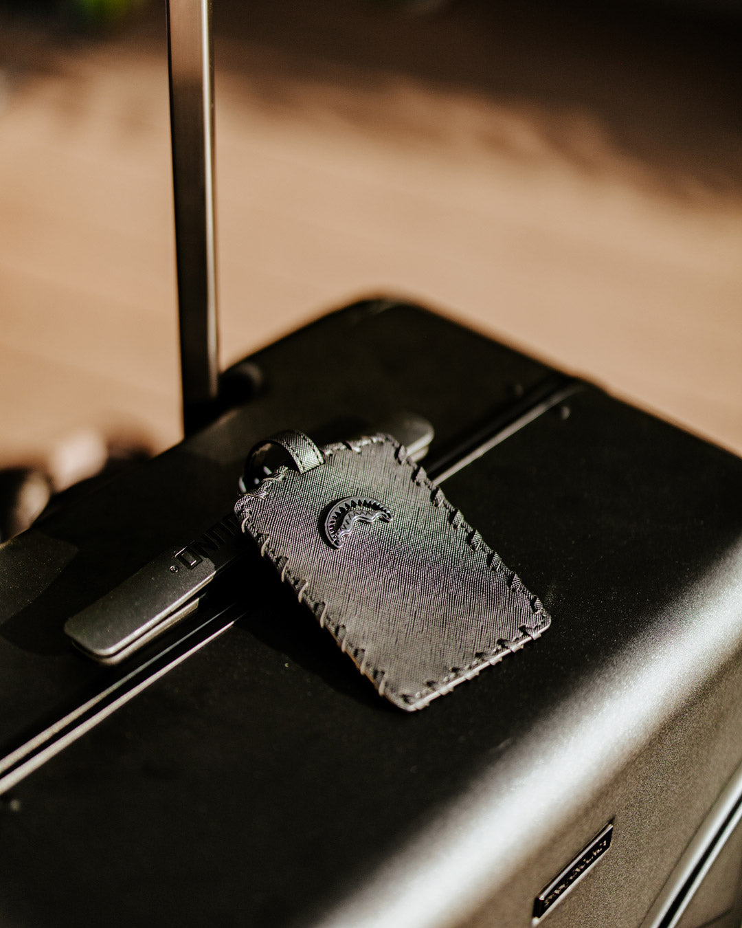 REALITY CHECK SHARKITECTURE CARRY-ON JETBLACK LUGGAGE (GUNMETAL HARDWARE)